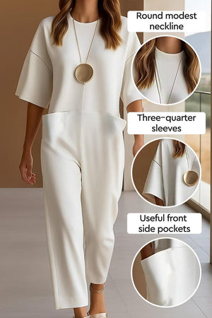 Serene Minimalist Pocket Jumpsuit with round neckline, three-quarter sleeves, and functional front side pockets in soft fabric