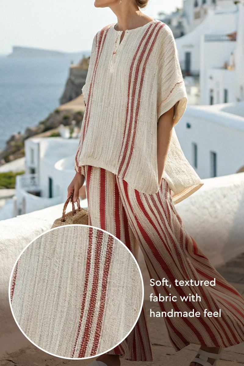Santorini Sunset Striped soft textured two-piece set with red vertical stripes on flowing blouse and pants.
