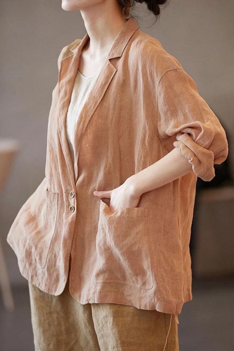 Woman wearing relaxed fit peach linen jacket shirt with notched lapel collar and large front pockets