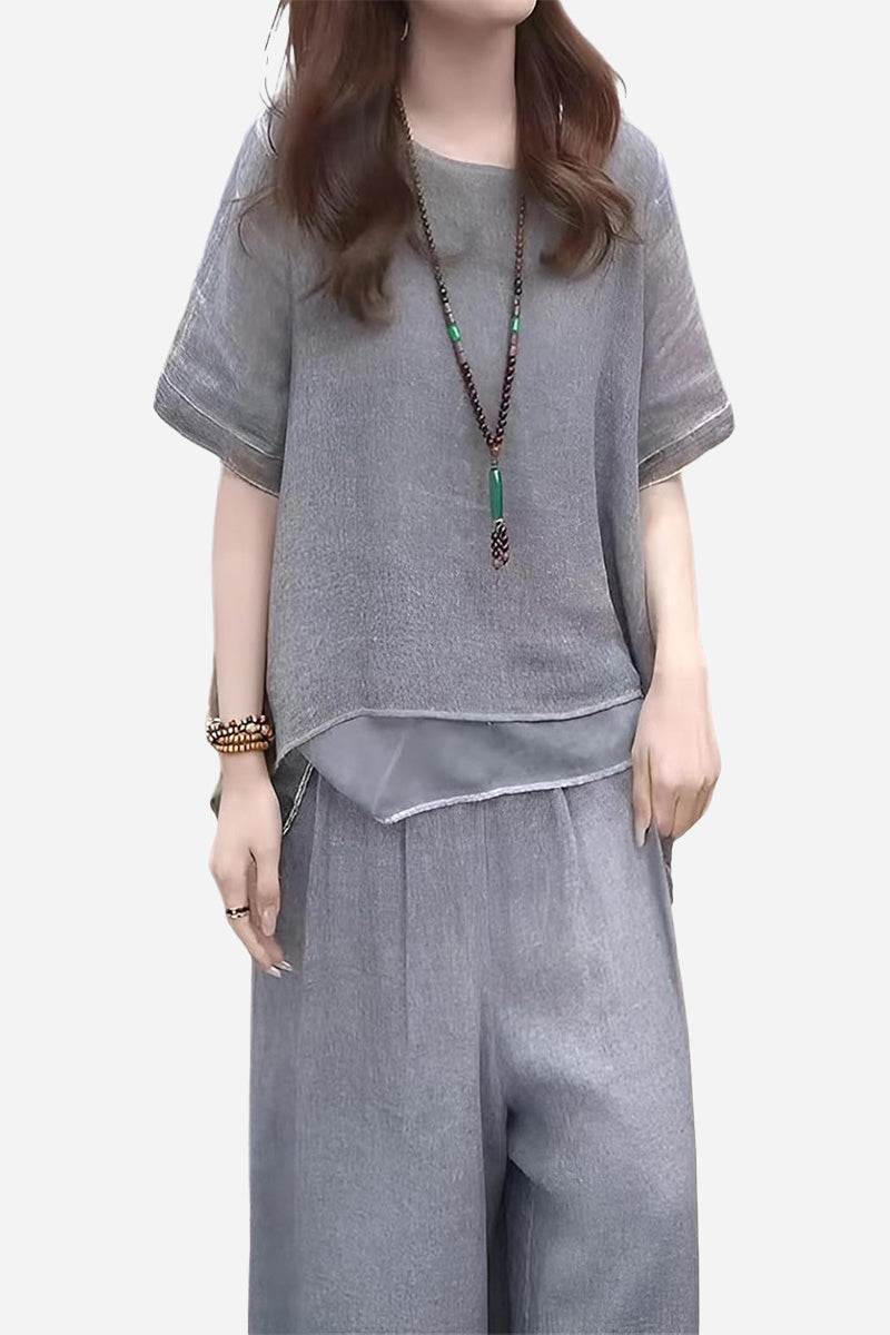 Woman wearing grey Provence cotton linen blend layered top and wide-leg trousers set with accessories