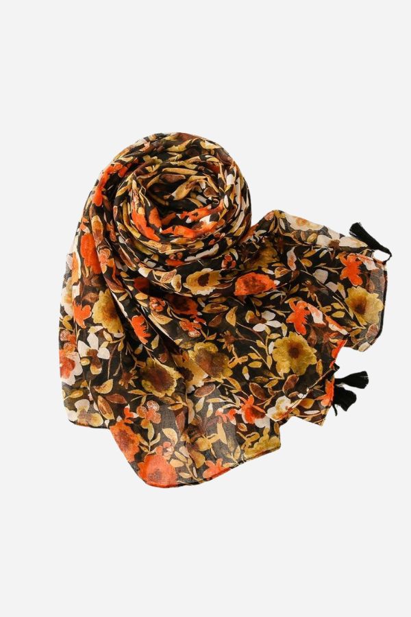 Twilight Blooms Scarf with warm floral print and tassel edges, lightweight and soft polyester fabric.