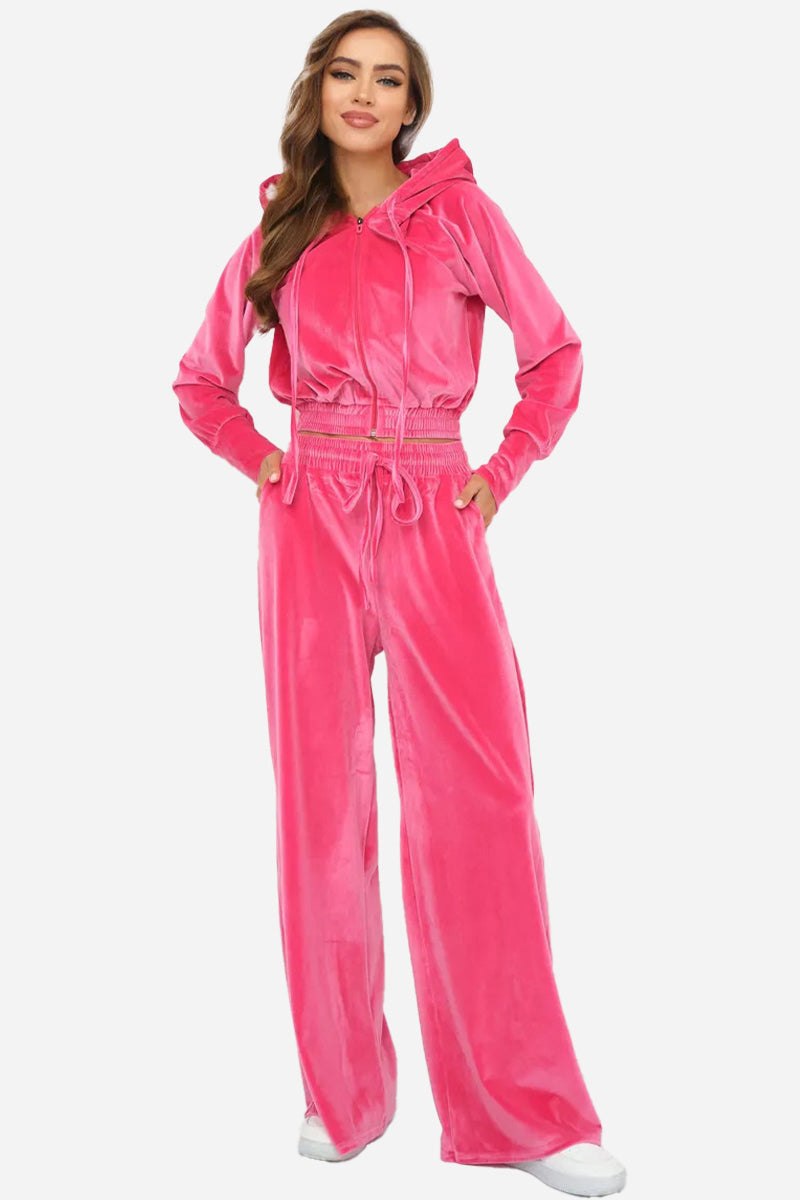 Women's vibrant pink velour tracksuit with cropped hoodie and high-waist pants