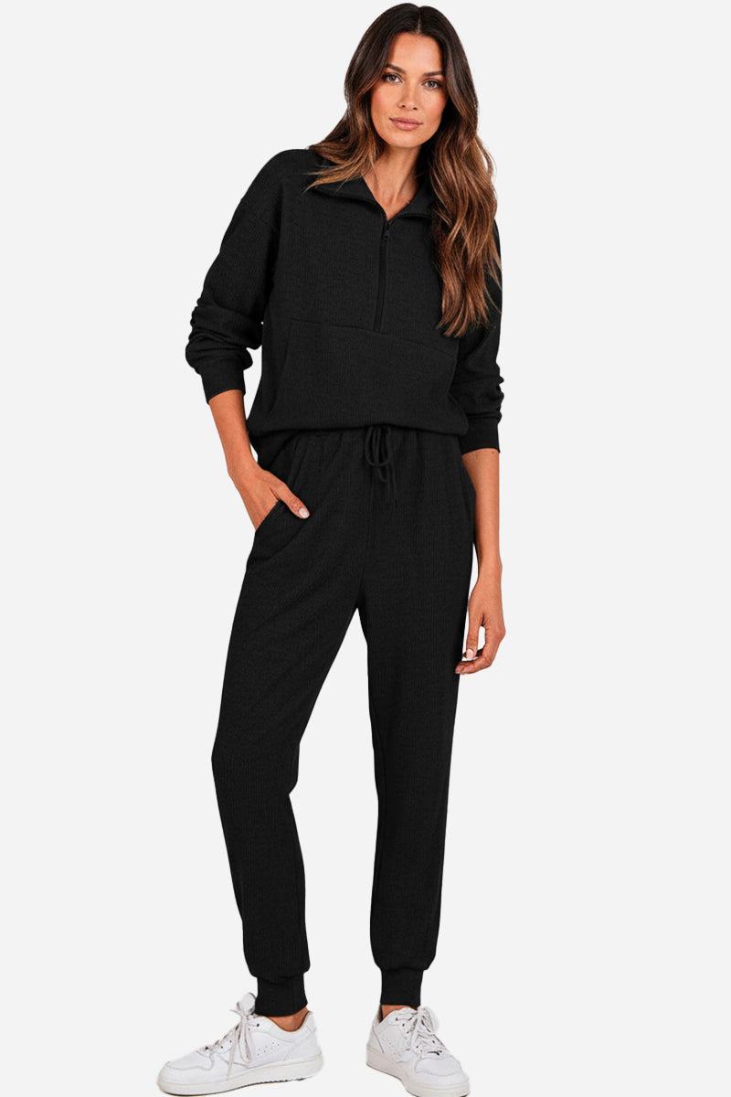 Unisex half-zip pullover and sweatpants set in black polyester blend, casual and comfortable for all-day wear