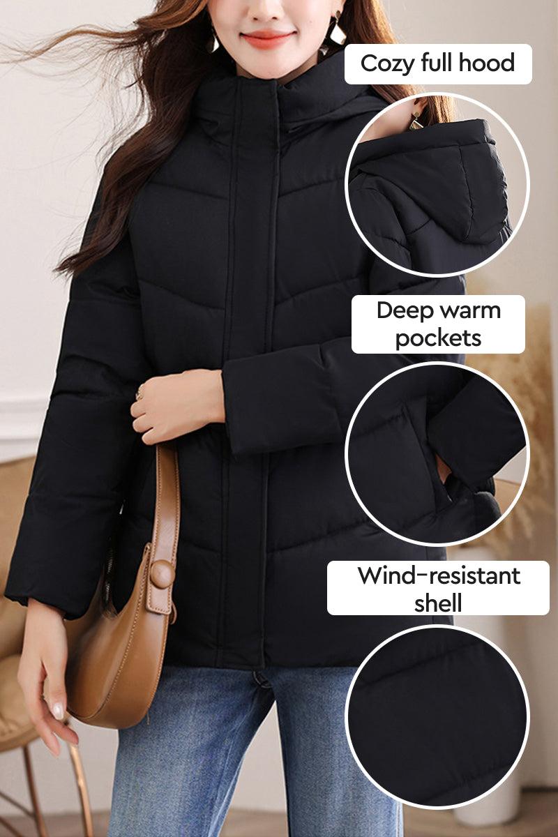 Women's Everyday Warmth Coat in black with full hood, deep pockets, and wind-resistant shell, lightweight and mid-length winter jacket.