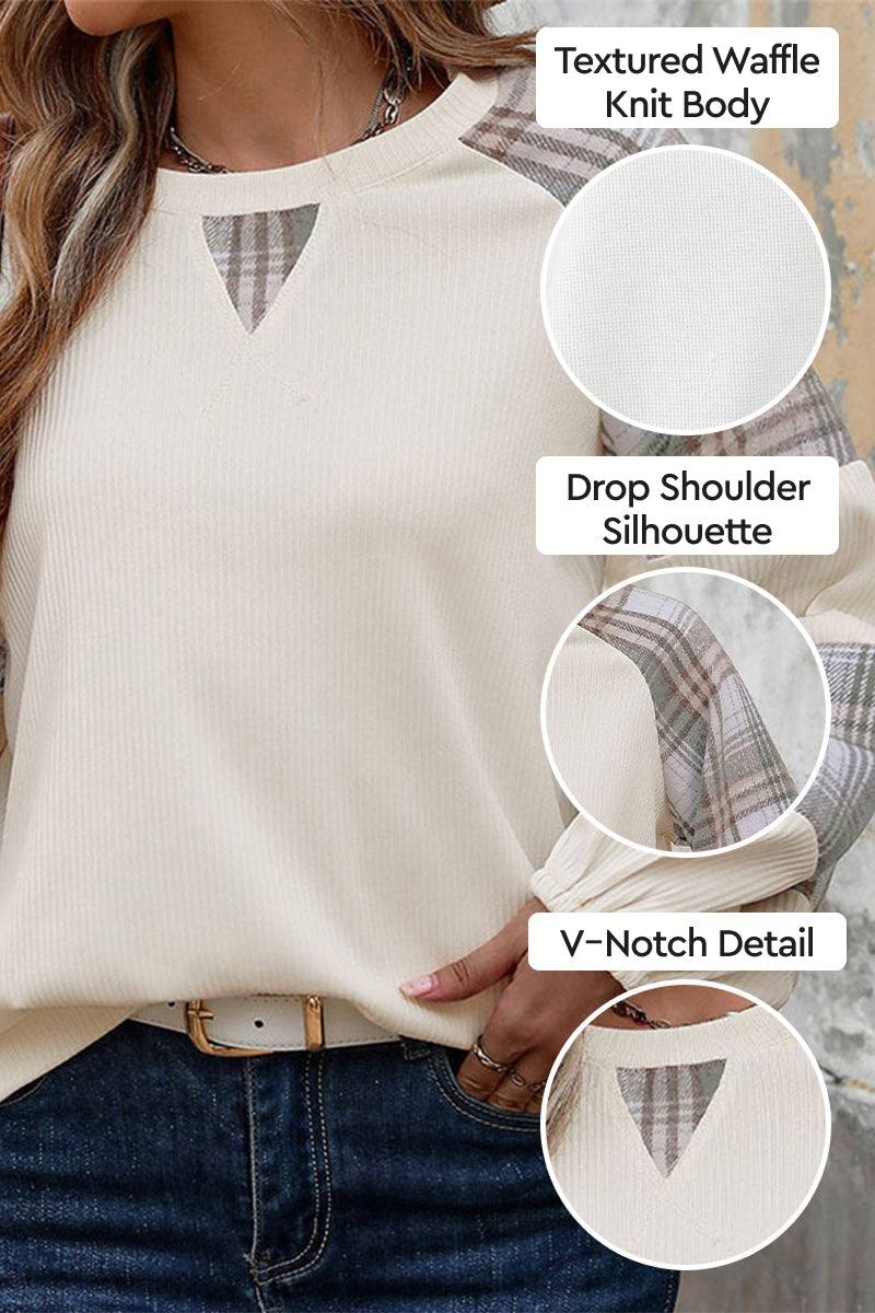 Waffle knit cream sweatshirt with plaid sleeves, drop shoulder fit, and V-notch neckline detail