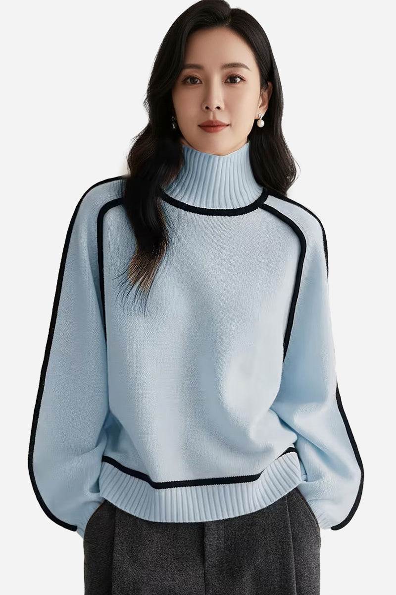 Woman wearing a light blue Zero Itch Turtleneck Sweater with black contrast trim and relaxed fit