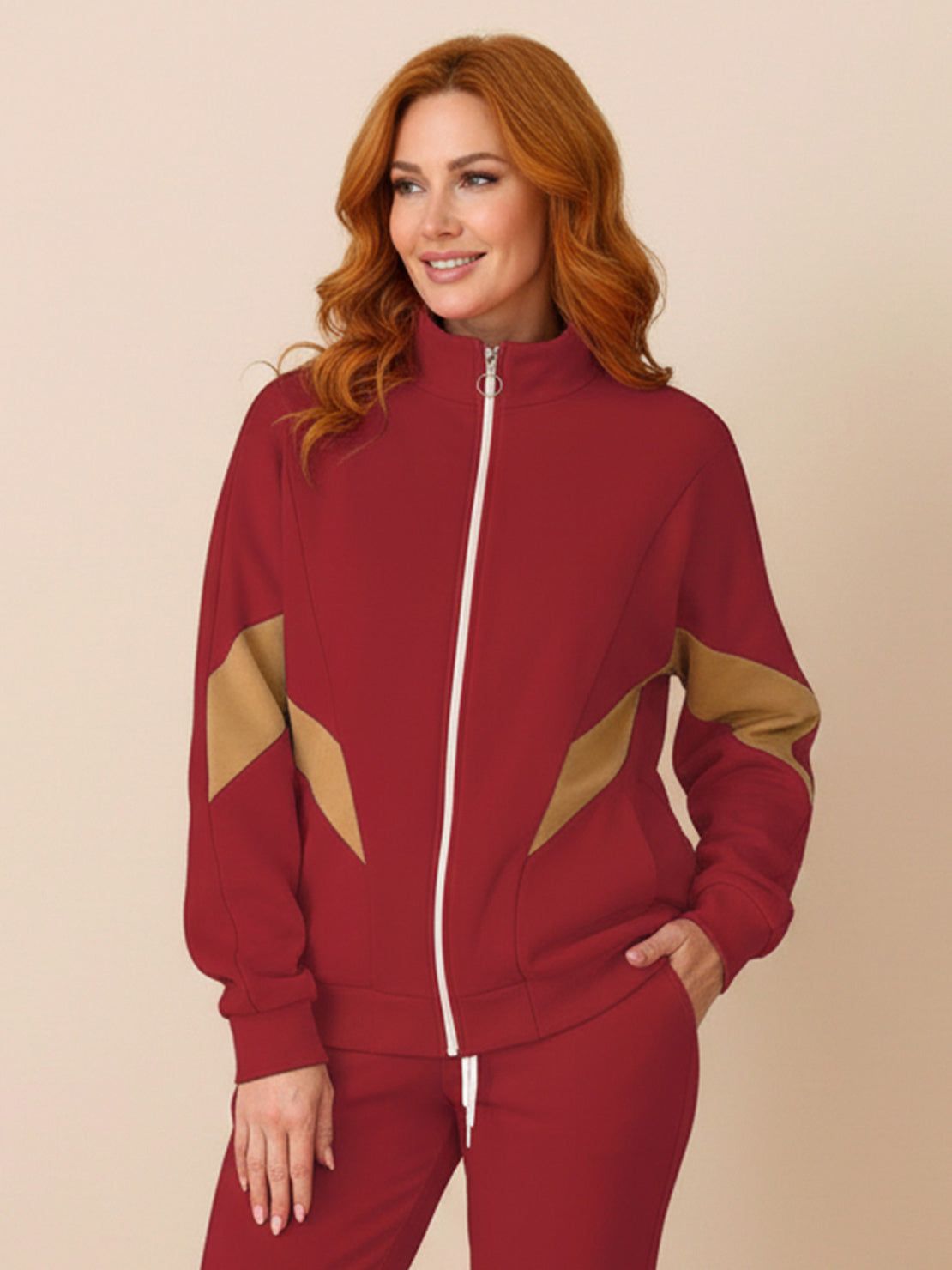 Woman wearing a colorblock comfort tracksuit with contrast curved panels and relaxed fit