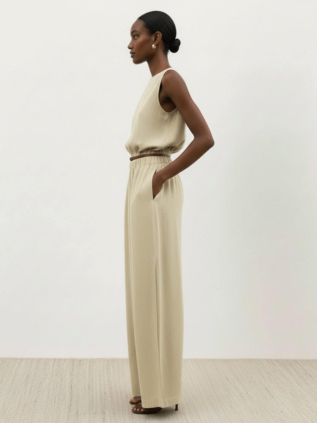 Lightweight linen-blend set with sleeveless top and wide-leg pants featuring elastic waistband and side slits for breathability