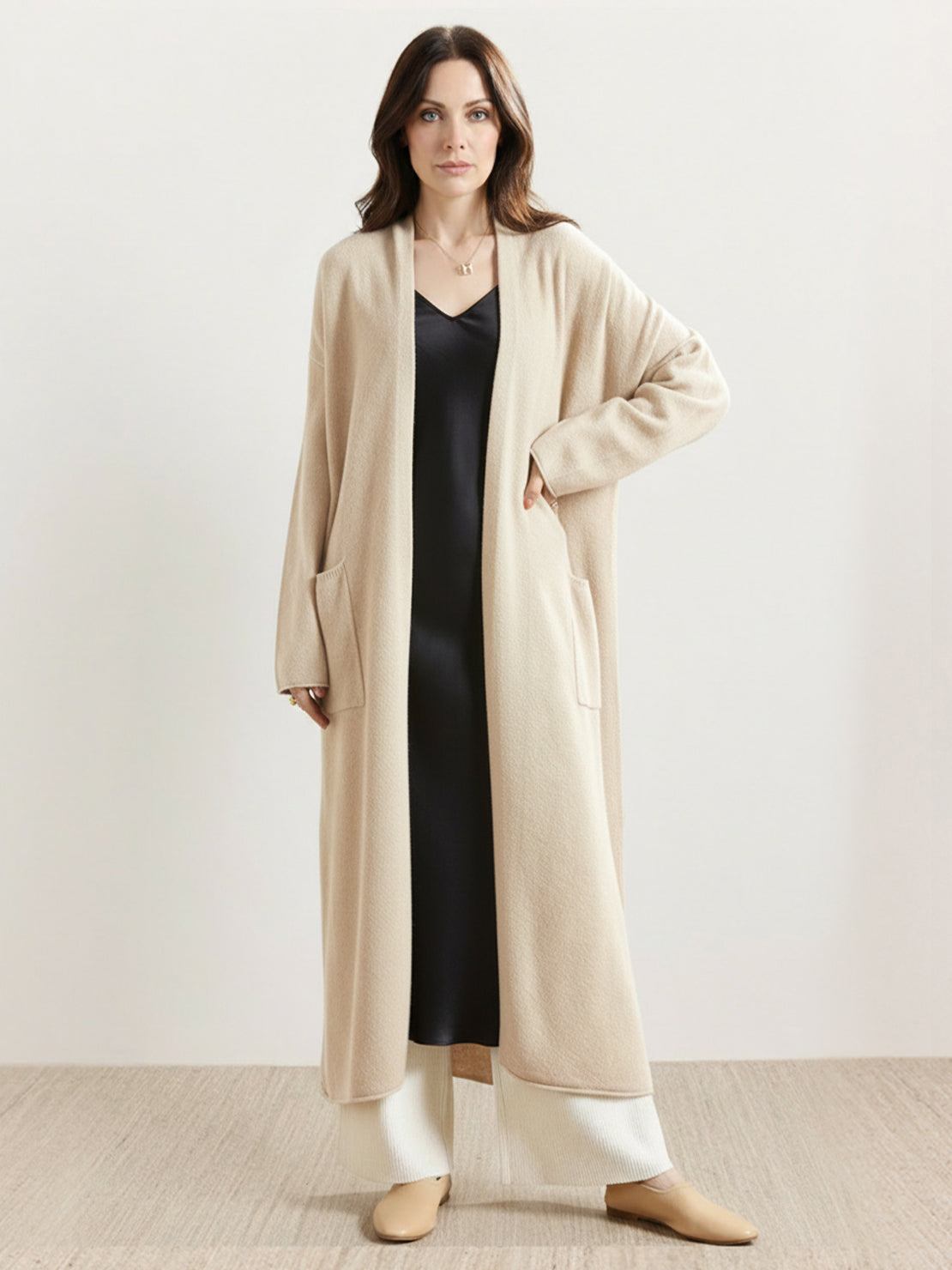 Long Australian Merino Wool cardigan with open front and front patch pockets, perfect for layering in fall and winter