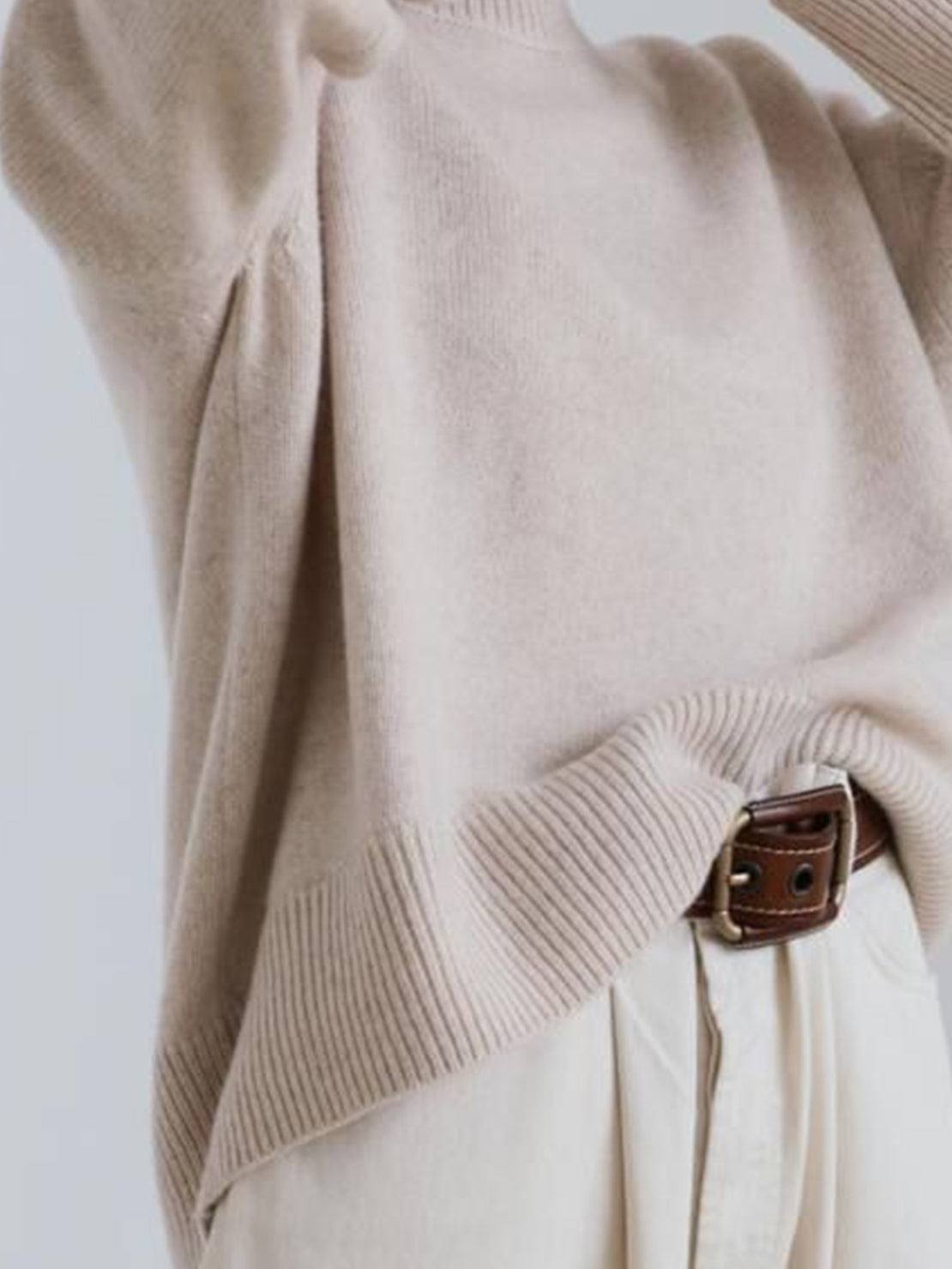 Oversized crew neck knit sweater with drop-shoulder sleeves and ribbed cuffs in neutral color