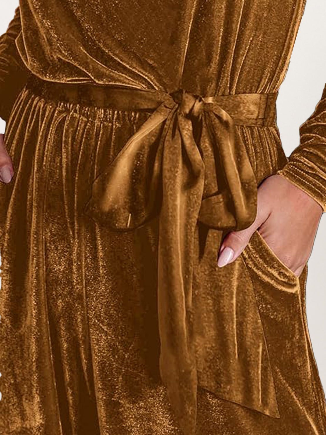 Woman wearing a stylish deep V-neck velvet suit with long sleeves and wide-leg pants