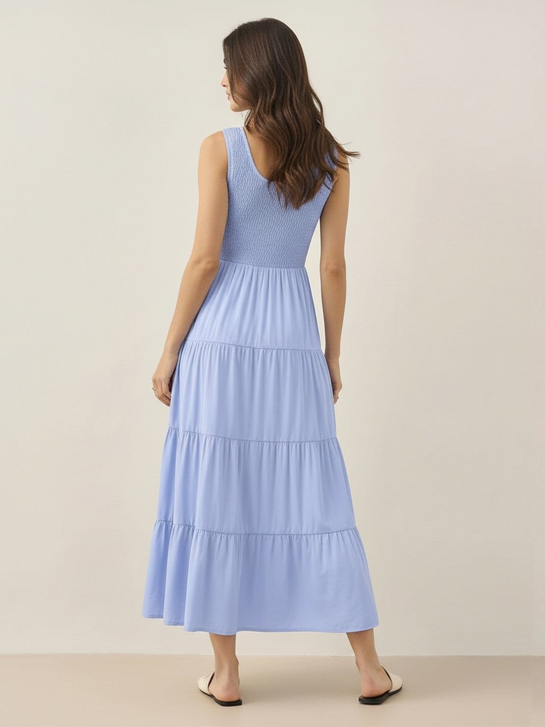 Smocked sleeveless maxi dress with tiered skirt and scoop neckline