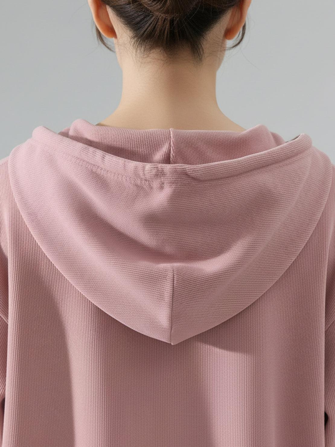 Woman wearing a soft chenille zip-up hoodie and wide-leg pants loungewear set with drawstring waist and side pockets