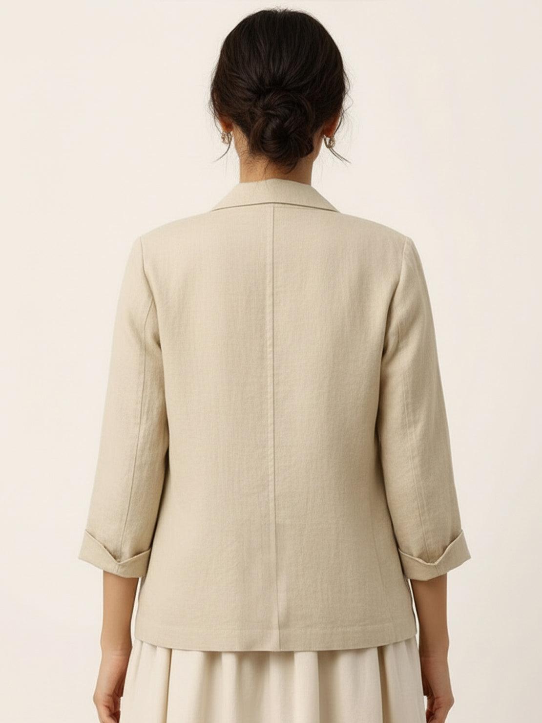 Cotton-linen blazer with relaxed fit, notch lapels, two-button closure, and natural textured fabric