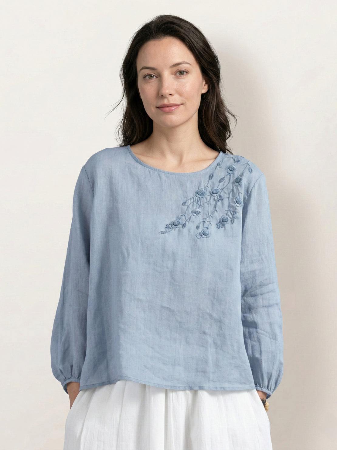 Cotton-linen embroidered blouse with relaxed boxy fit, 3/4 balloon sleeves, elastic cuffs, and subtle floral embroidery on shoulder