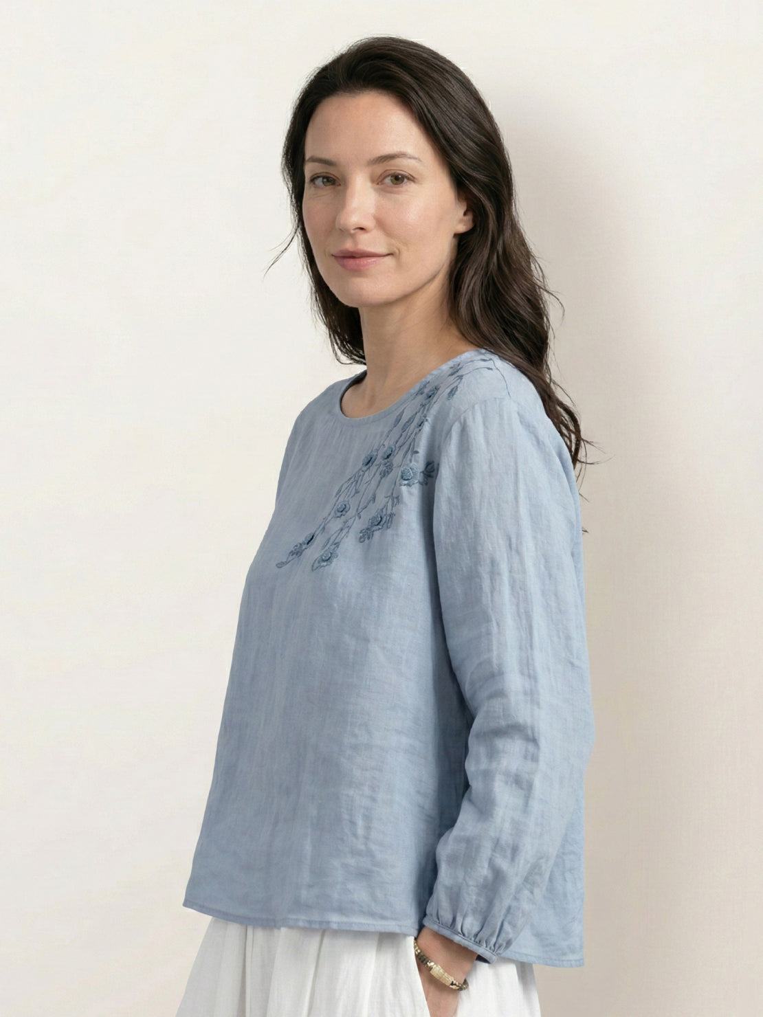 Hip-length cotton-linen embroidered blouse with 3/4 balloon sleeves and gathered cuffs in relaxed boxy fit.