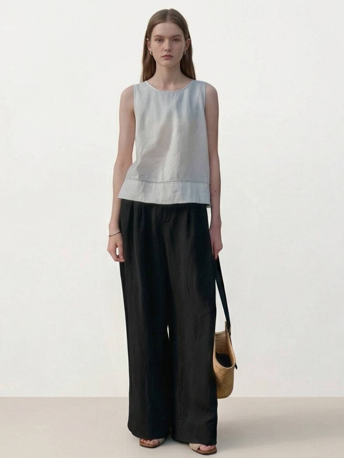 White Tencel-linen pleated wide-leg pants with structured waist and floor-length silhouette