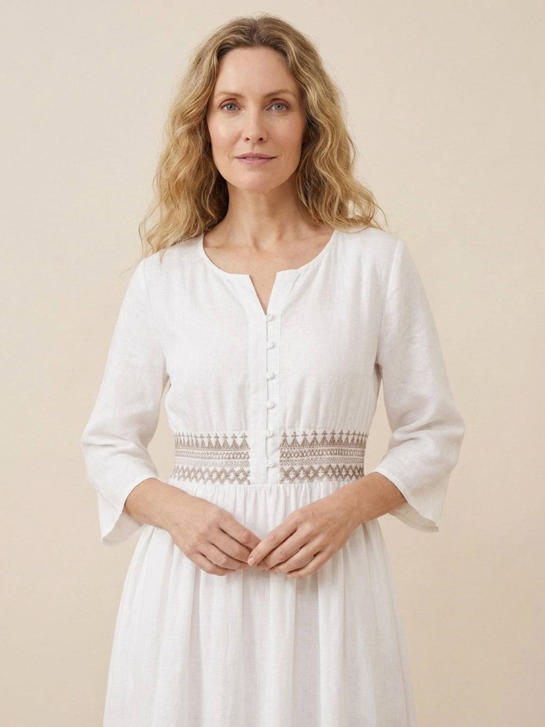 Rusty orange cotton linen dress with embroidered smocked waist and asymmetric midi skirt