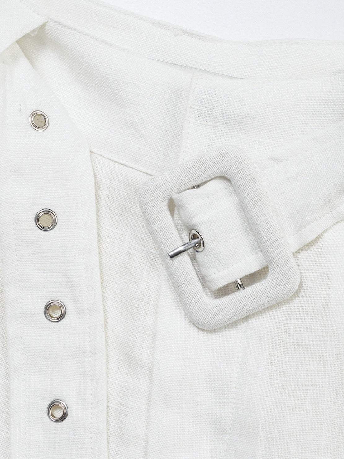 White high-rise linen belted shorts with wide-leg relaxed fit and covered buckle belt detail