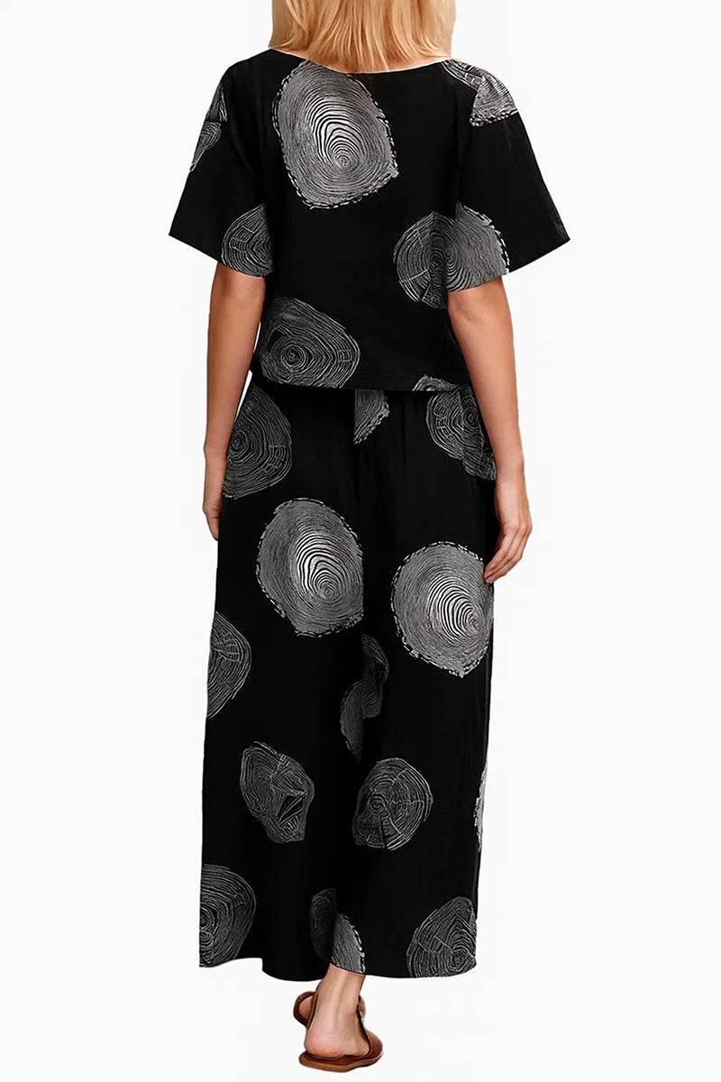 woman wearing Breezy Meadow Two-Piece Set with relaxed top and wide-leg trousers in light fabric