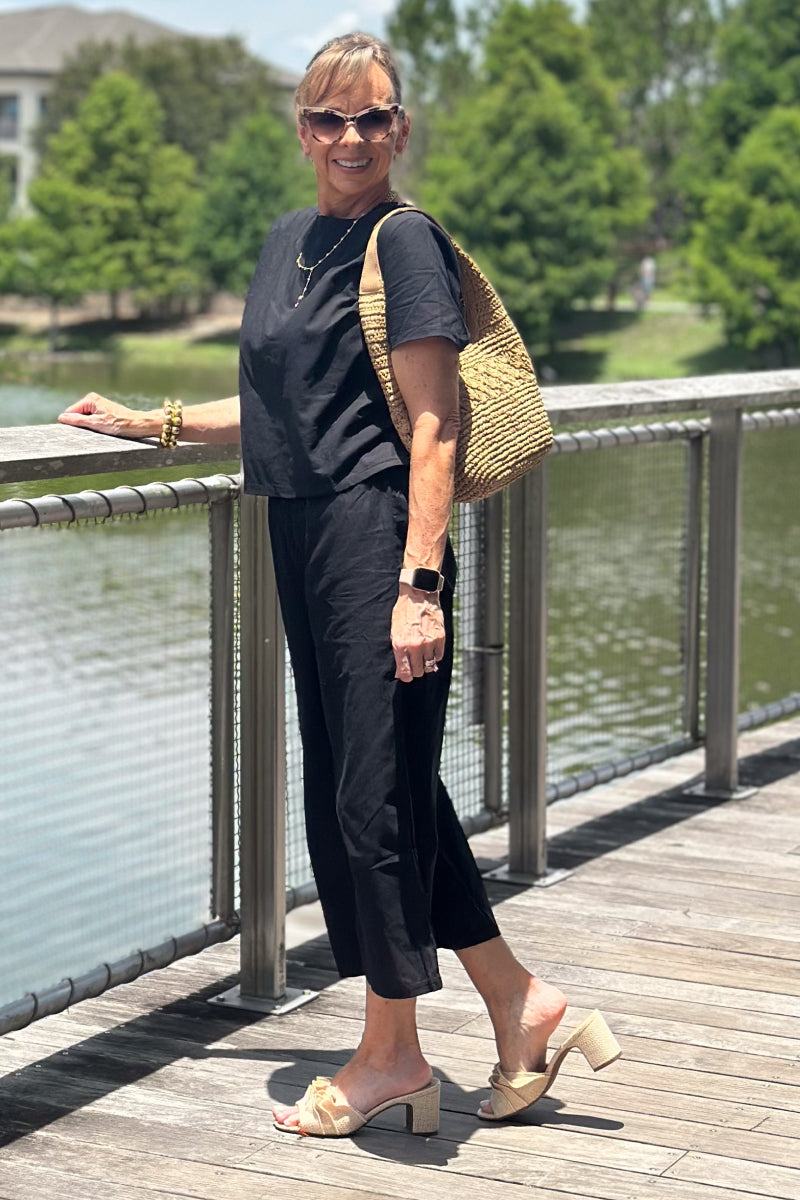 woman wearing Breezy Meadow Two-Piece Set with relaxed fit top and wide-leg trousers in lightweight fabric