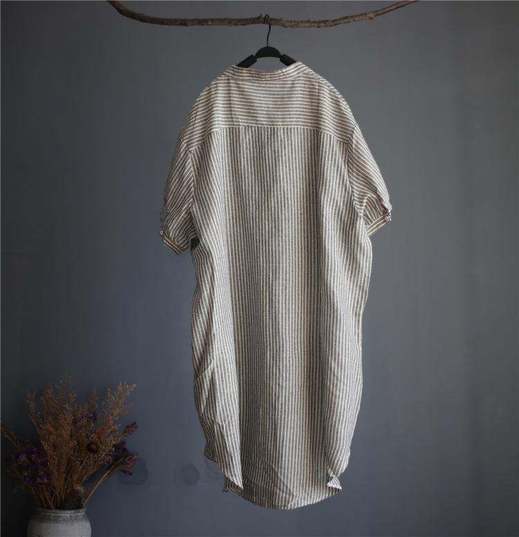 Striped linen blend gauze midi shirt dress with short sleeves and button fastening hanging on wooden hanger