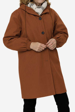 Water-resistant oversized hooded windbreaker rain jacket in brown with button closure and elastic cuffs
