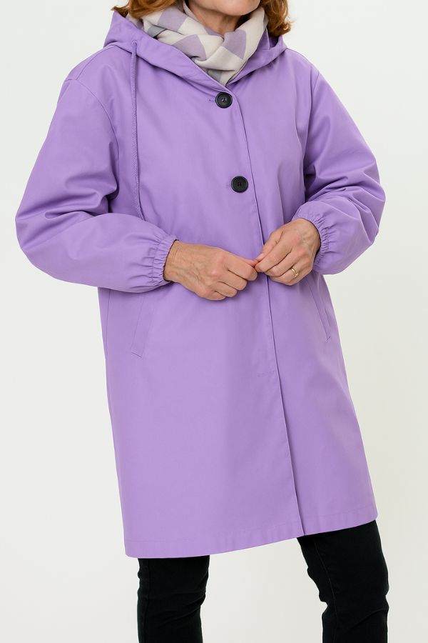 Lavender oversized water-resistant windbreaker jacket with hood and front buttons, styled for outdoor wear
