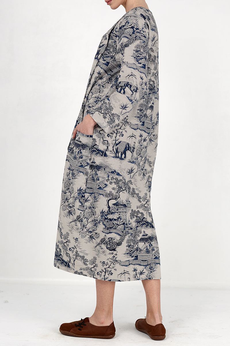 Woman wearing Japanese porcelain print midi dress with blue pattern and oversized pockets