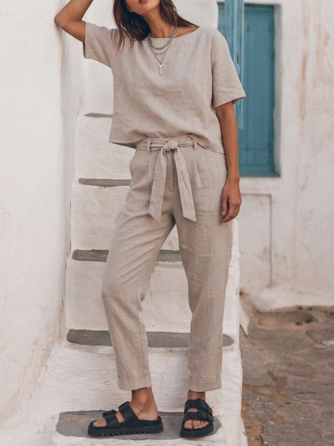 woman wearing relaxed cotton linen set with short-sleeve top and straight-leg pants in monochrome color