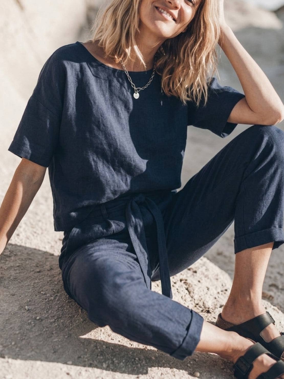 woman wearing breathable cotton linen set monochrome two-piece outfit
