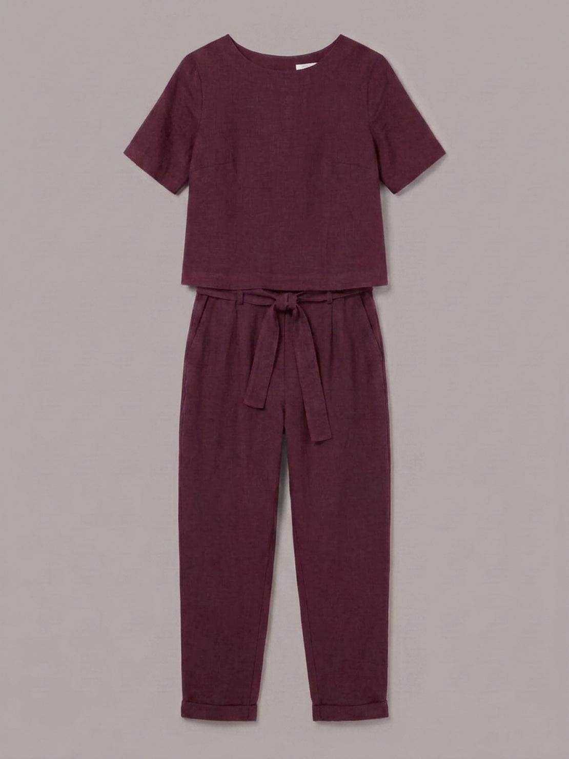 Woman wearing a relaxed cotton linen set with short-sleeve top and straight-leg pants in a monochrome palette
