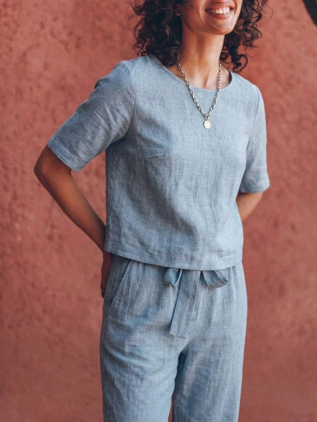 woman wearing relaxed cotton linen set with short-sleeve top and straight-leg pants in monochrome