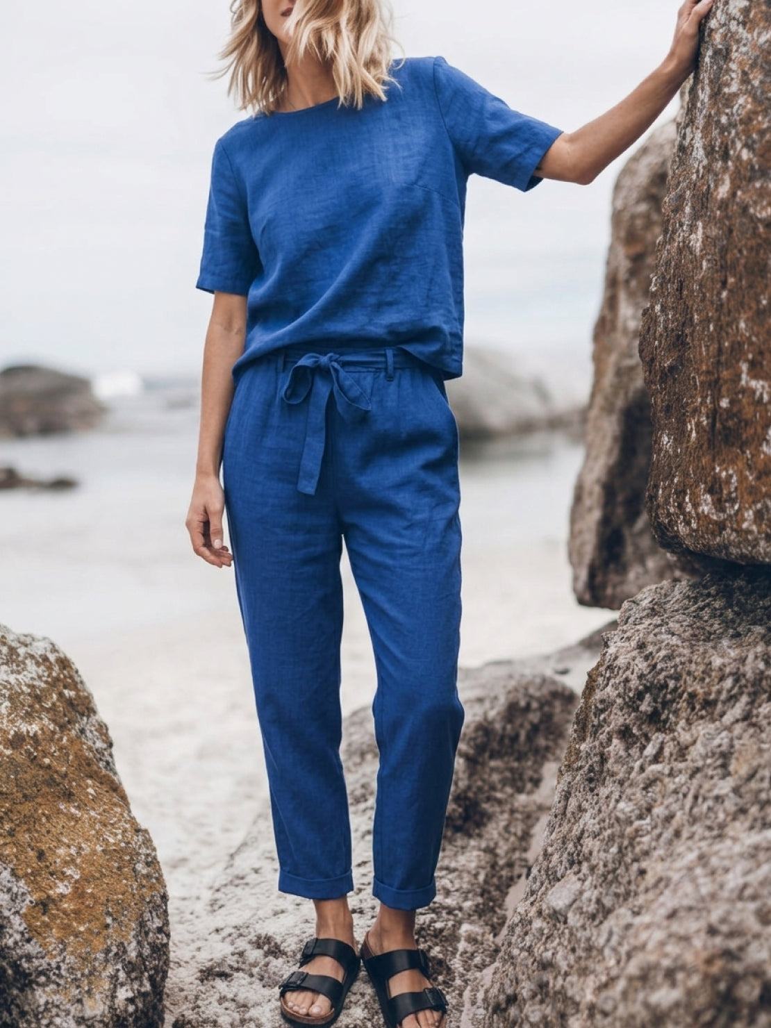 Woman wearing breathable cotton linen set with relaxed monochrome two-piece outfit
