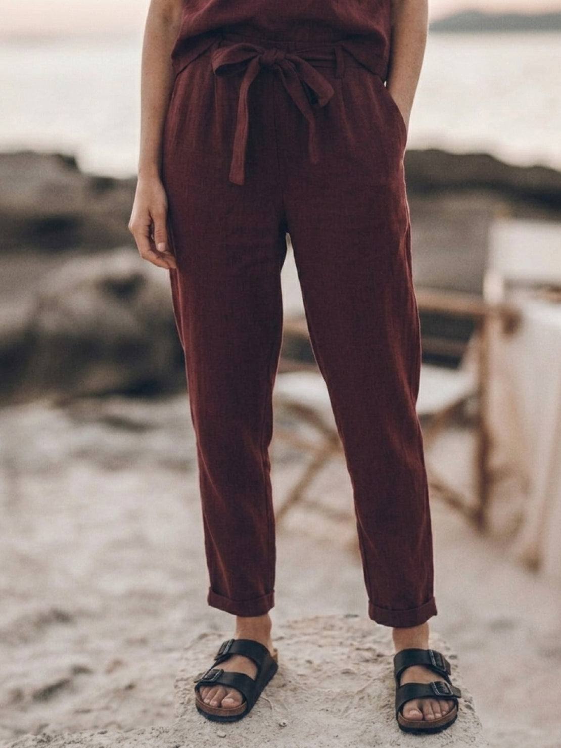 woman wearing relaxed cotton linen set with short-sleeve top and straight-leg pants in monochrome tone