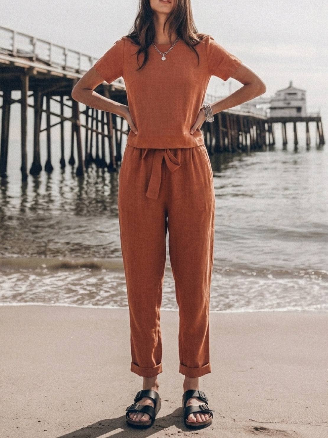 woman wearing relaxed cotton linen set with short-sleeve top and straight-leg pants in monochrome tones