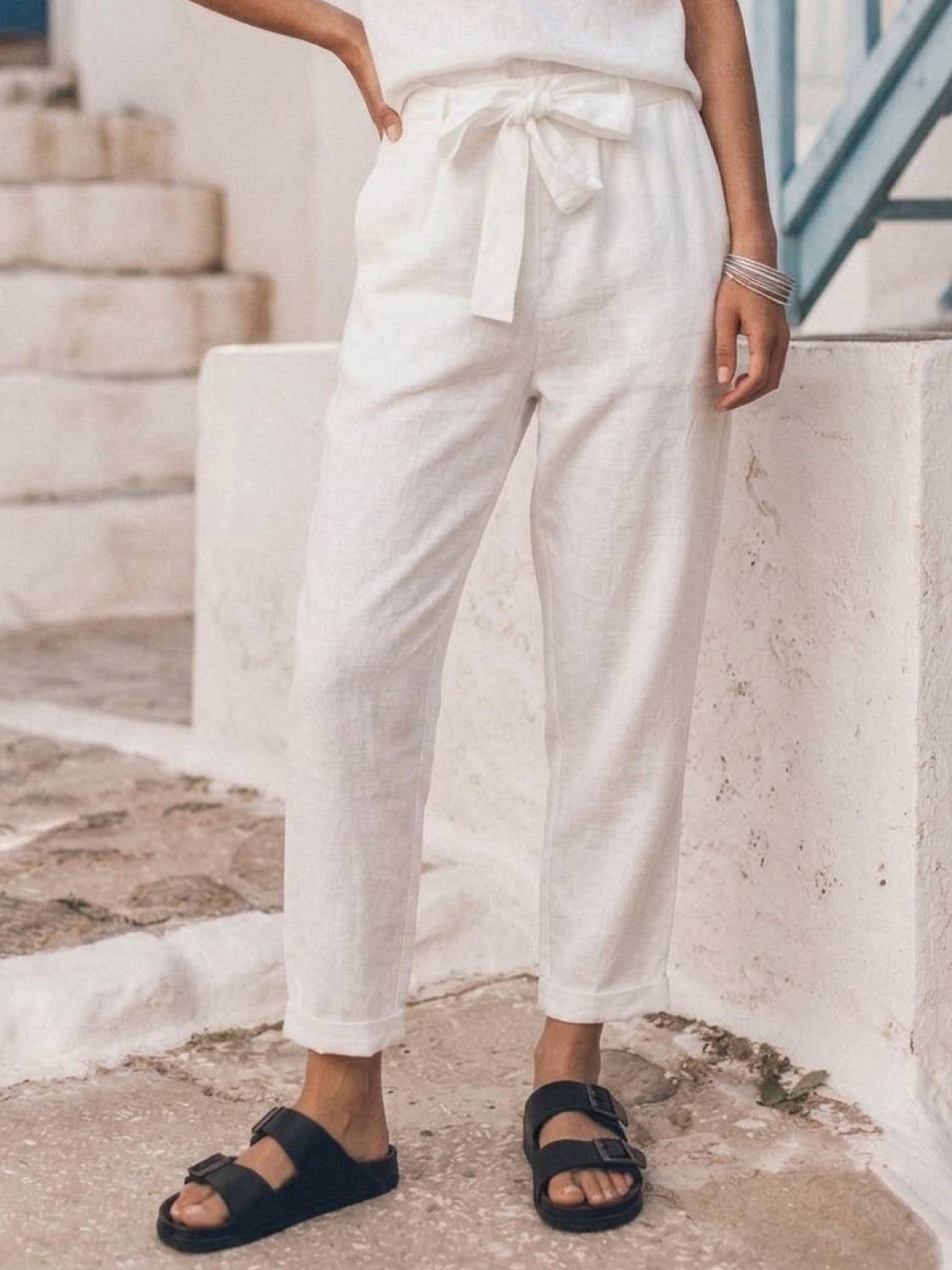 Woman wearing relaxed monochrome cotton linen set with short sleeve top and straight-leg pants