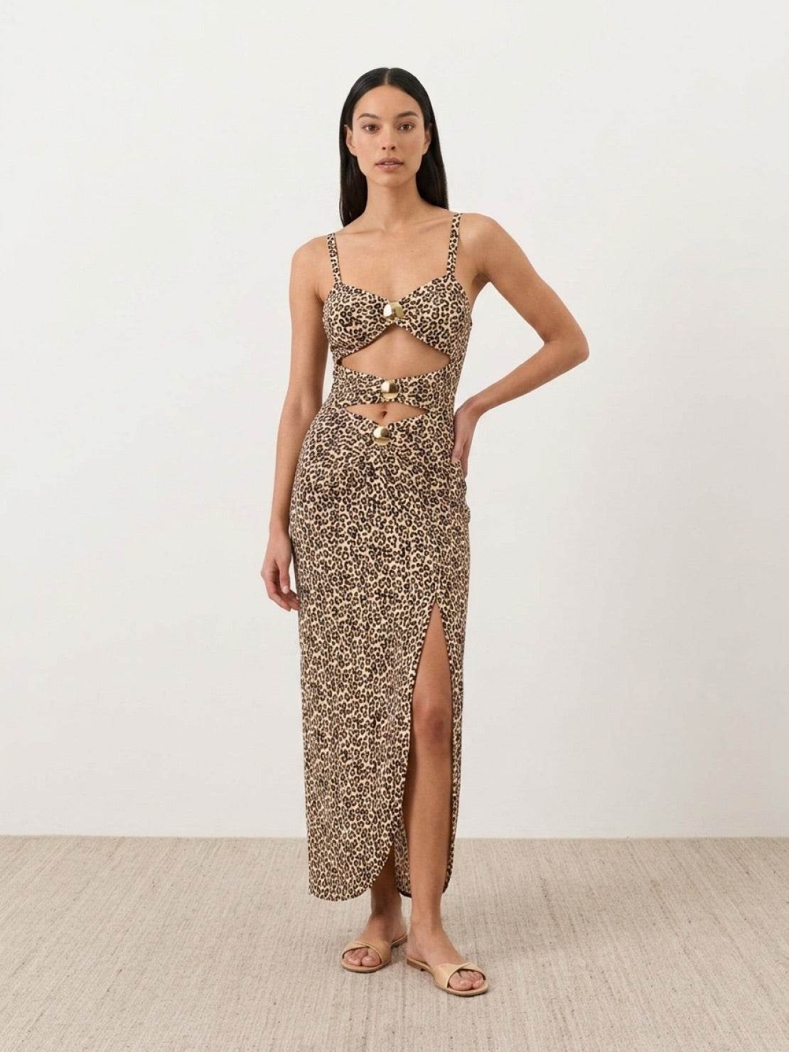 Gold-detail cutout one-piece swimsuit with ruched panels and midi wrap skirt on white background