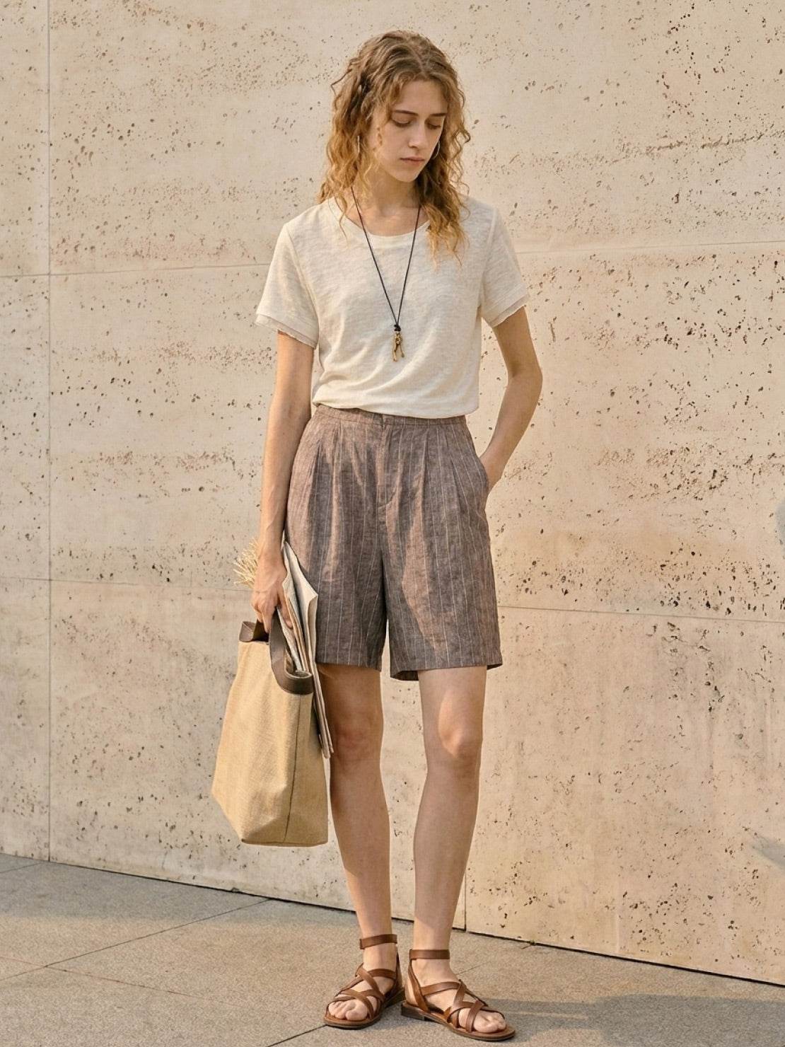 100% linen tee with rolled cuff sleeves and relaxed scoop neckline
