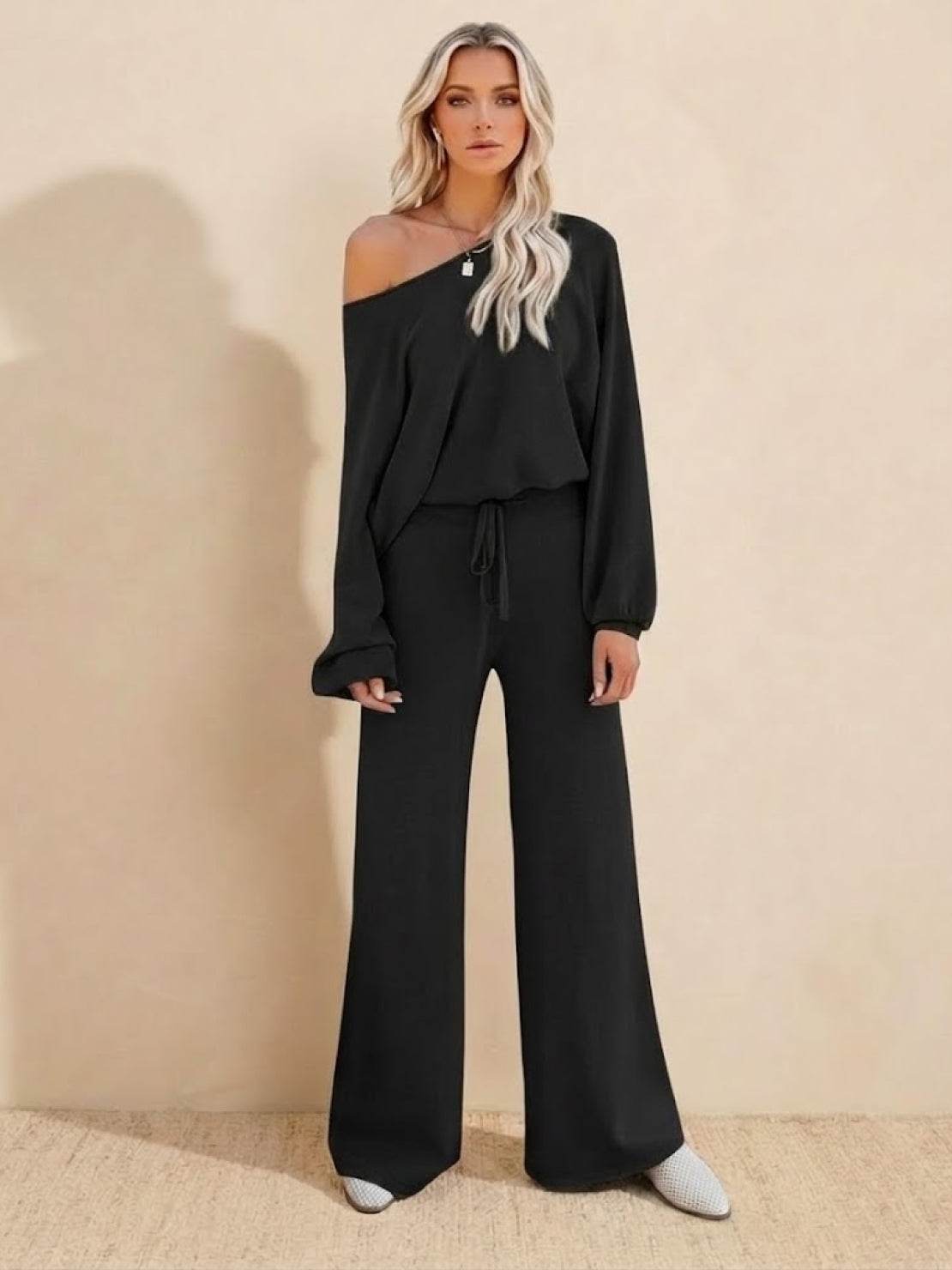 woman wearing black round neck loose fit cozy two-piece set with wide-leg pants