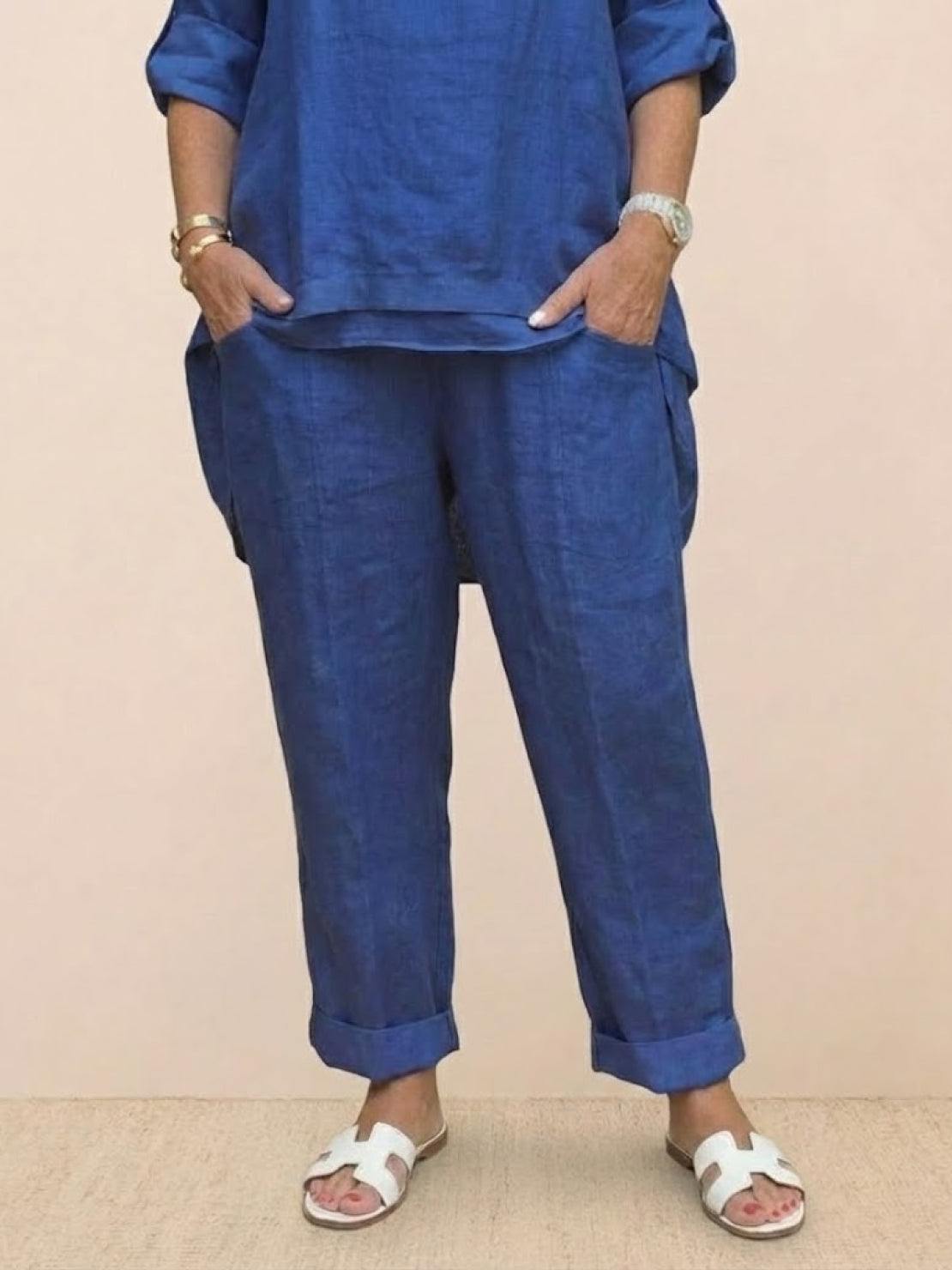 Blue asymmetrical two-piece trouser set with rolled-up sleeves and tapered pants for casual and semi-formal wear