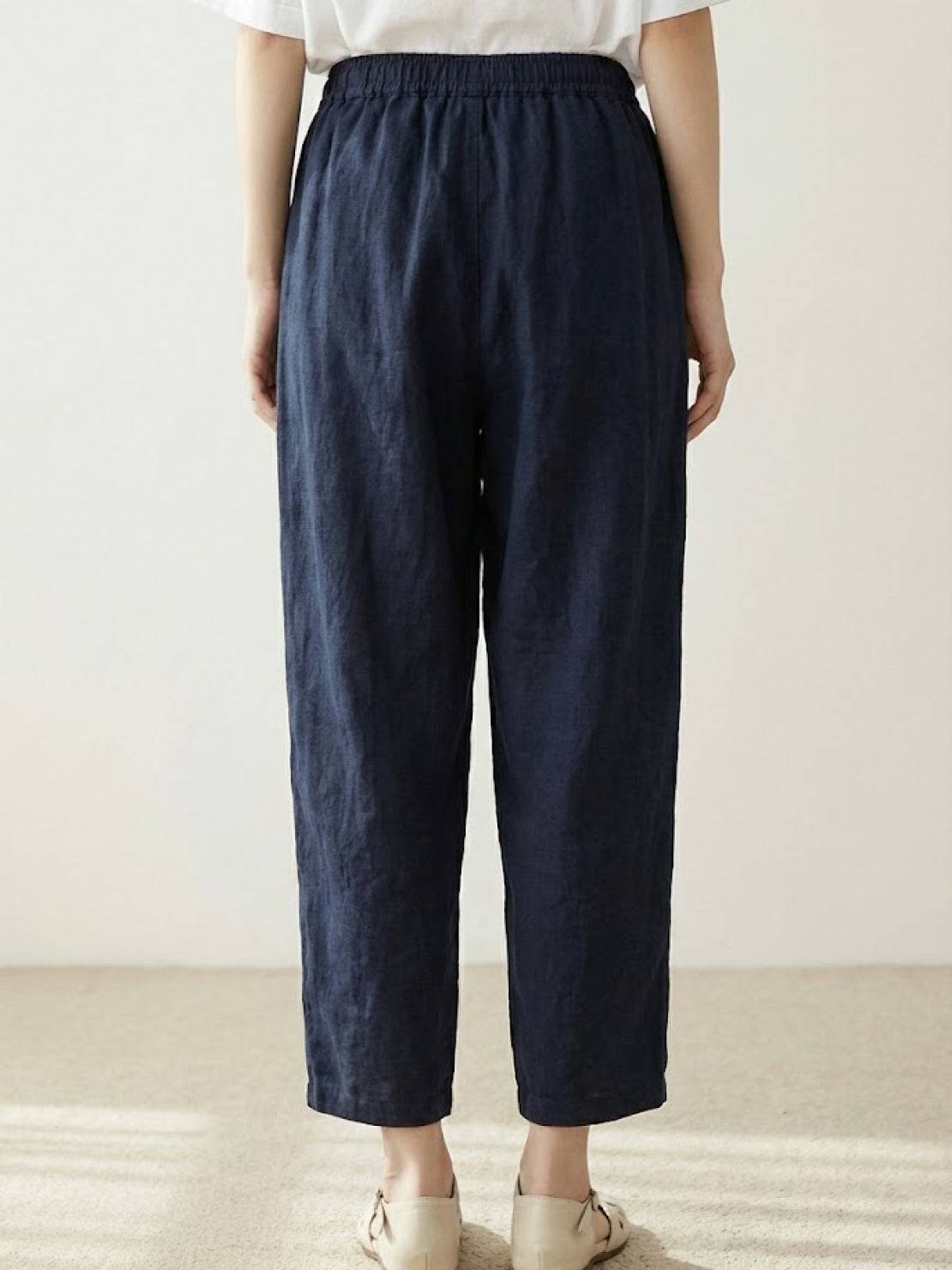 Woman wearing breezy relaxed fit straight pants in a stylish casual outfit