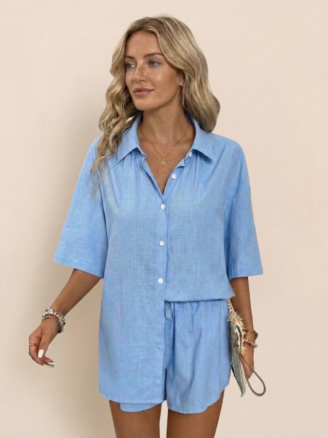 Woman wearing stylish Coastal Linen Cotton two-piece set in neutral tones on white background