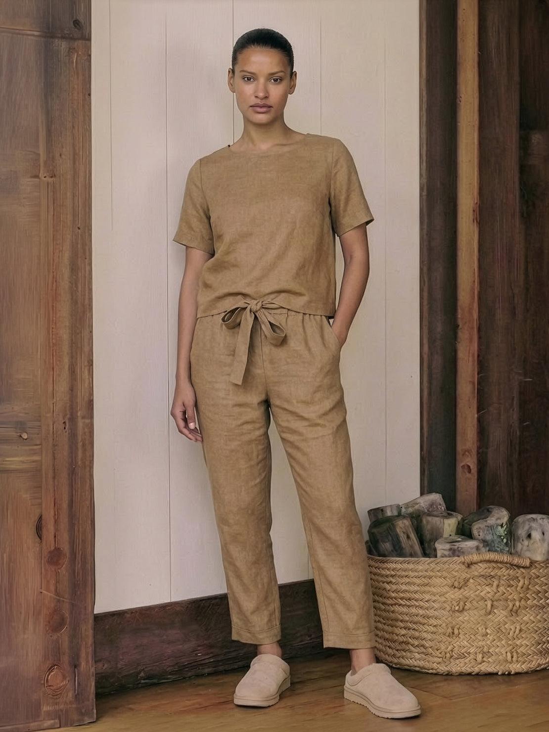 Woman wearing a relaxed cotton linen set with a monochrome short-sleeve top and straight-leg pants
