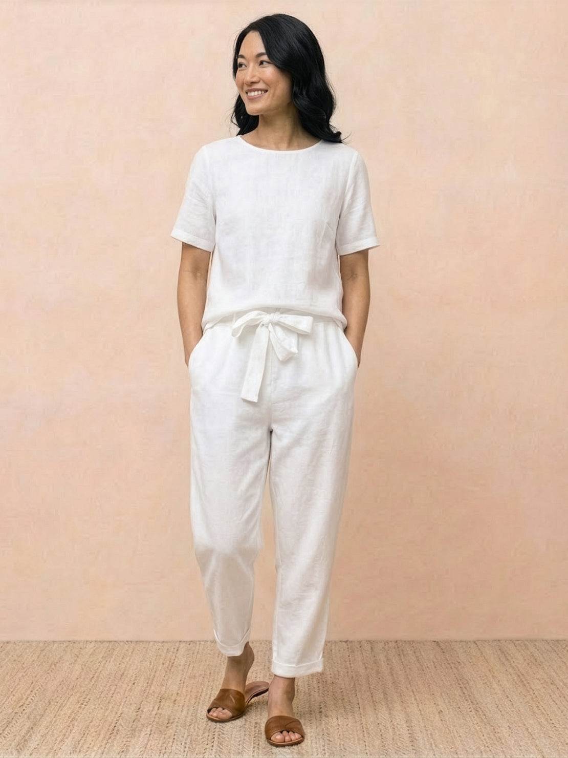 Woman wearing a relaxed cotton linen set with monochrome short-sleeve top and straight-leg pants