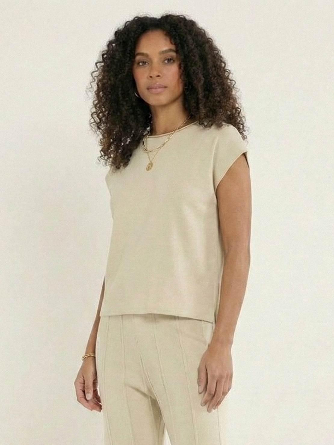 First Class Travel two-piece set in soft, wrinkle-resistant viscose-acrylic fabric with pleated wide-leg pants and matching top for versatile, comfortable elegance.