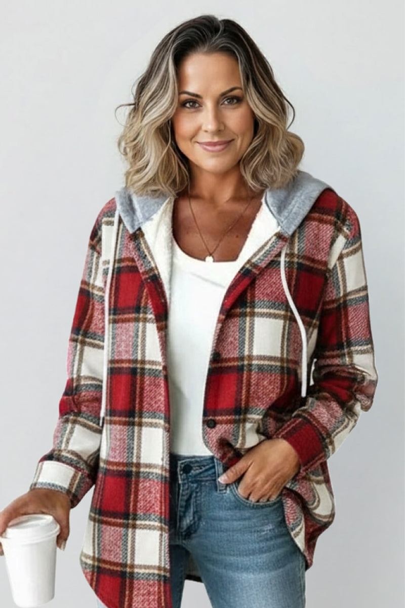 Highland Plaid Shacket with red and white plaid pattern, fleece lining, attached hood, button-front closure, and front pockets, worn casually with jeans.