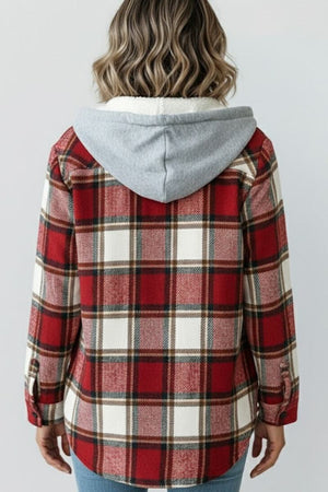 Back view of woman wearing Highland Plaid Shacket with red plaid pattern and attached gray hood