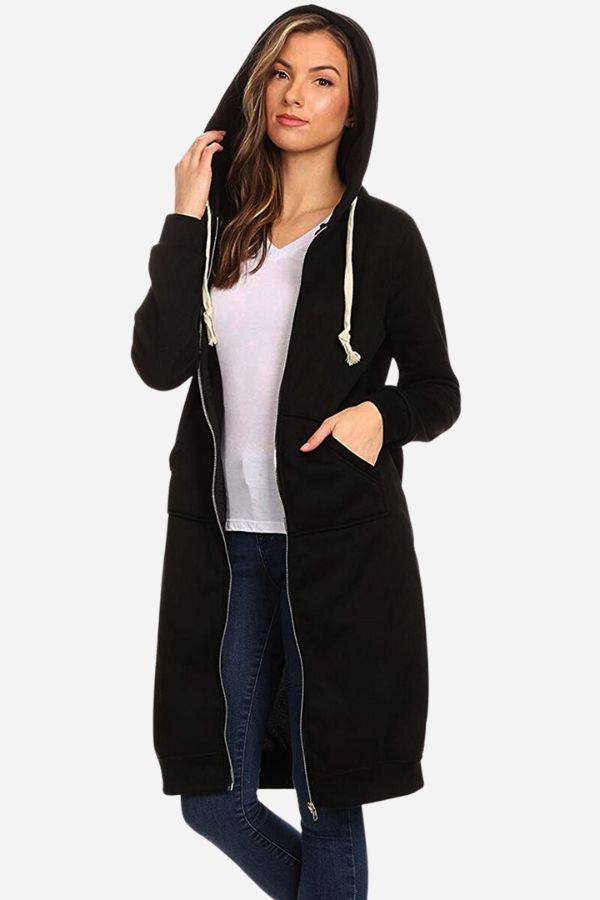 Woman wearing black oversized long zip sweatshirt hoodie with drawstring hood and large front pockets