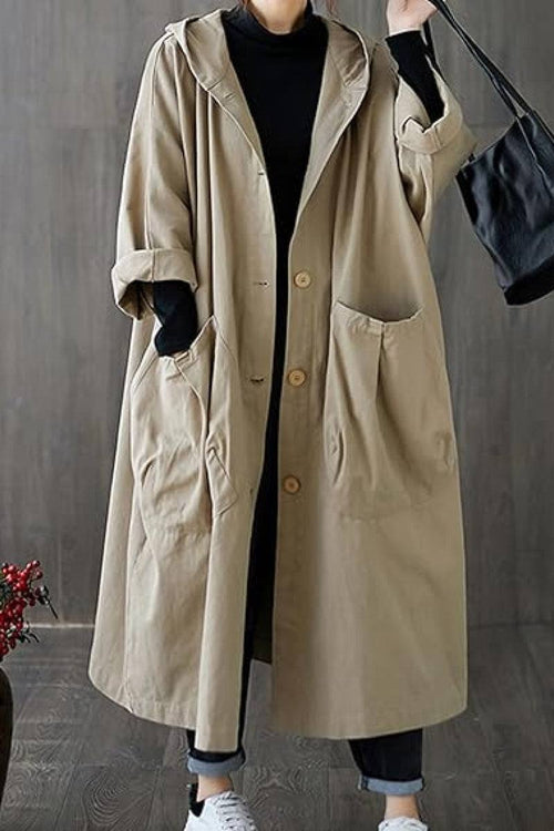 Oversized water-resistant windbreaker jacket with waterproof design, attached hood, snap-button closure, and large front pockets.